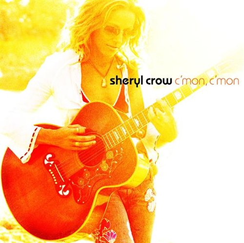 Sheryl Crow playing an acoustic guitar on the album cover "C'mon, C'mon".
