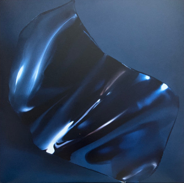 Shiny, abstract blue form with light reflections on a dark background.