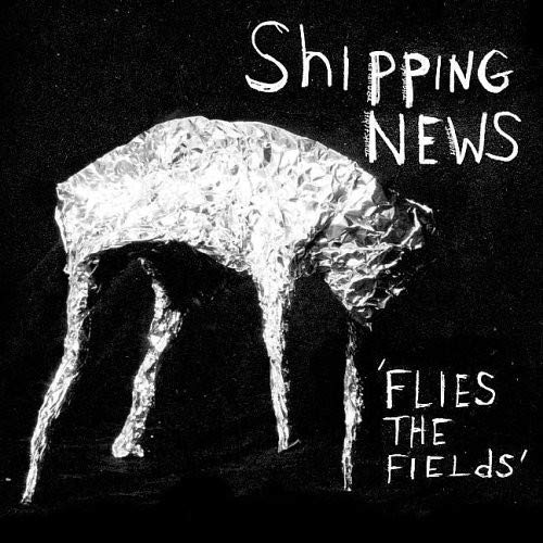 Black and white album cover featuring a dog-like figure covered in foil.