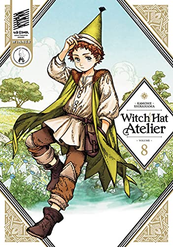 Young man in green hat and cloak standing in a field with trees behind.