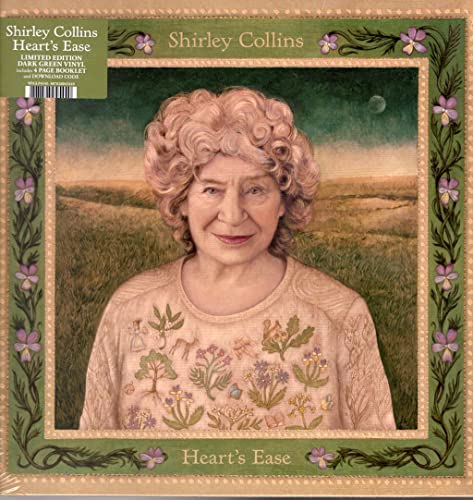 Portrait of Shirley Collins wearing a floral sweater, framed by a decorative botanical border.
