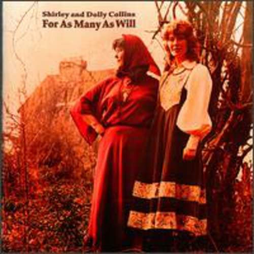 Shirley and Dolly Collins stand outdoors in traditional folk attire against a reddish background.