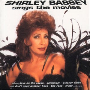 Shirley Bassey album cover, portrait with dark feathers and text.