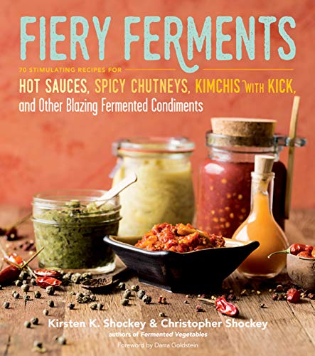 Book cover featuring jars of colorful fermented foods and chili peppers.