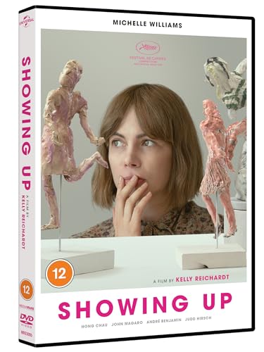 DVD cover for Showing Up featuring Michelle Williams behind two small clay sculptures.