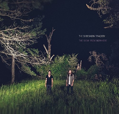 CD cover: two men stand in a grassy field at night.