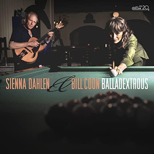 Two musicians with a guitar and billiards table, album cover.