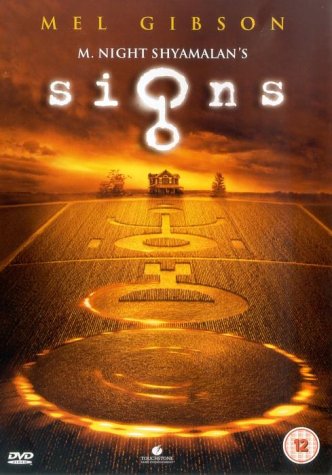 DVD cover for the movie Signs showing a farmhouse and crop circles at sunset.