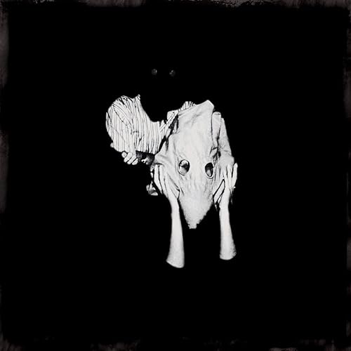 Black and white album cover featuring a distorted animal head image.