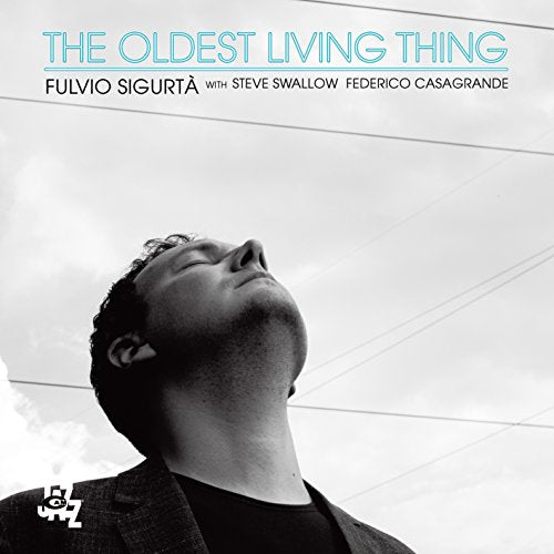 CD cover with a low-angle black and white portrait of a man.