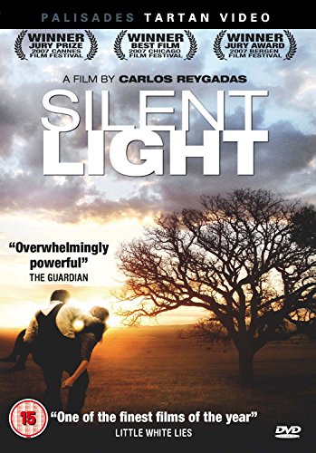 DVD cover for “Silent Light” featuring a couple silhouetted against a sunset.