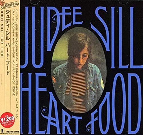 Jude Sill’s “Heart Food” CD cover with portrait in an oval frame.