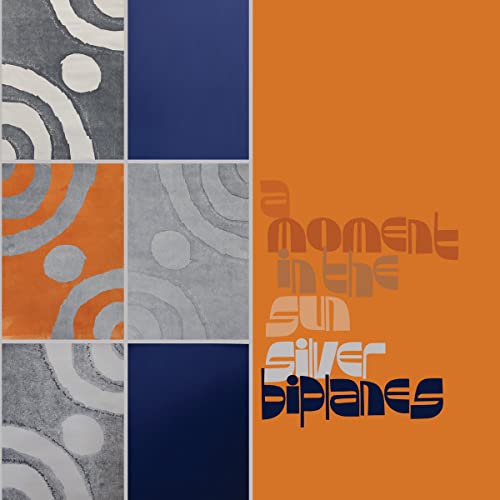 Album cover with abstract silver swirls and orange text reading "Silver Biplanes".