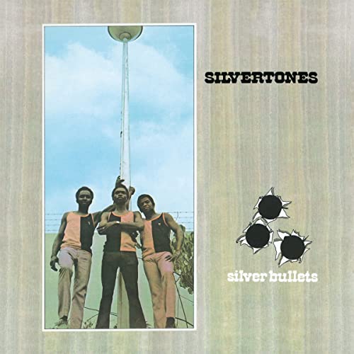 Album cover: three men looking up at a pole under a blue sky.
