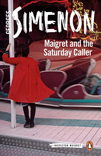 A person in a red coat stands by a post at a fairground ride.