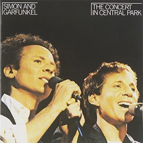 Simon & Garfunkel album cover featuring the duo performing with microphones.