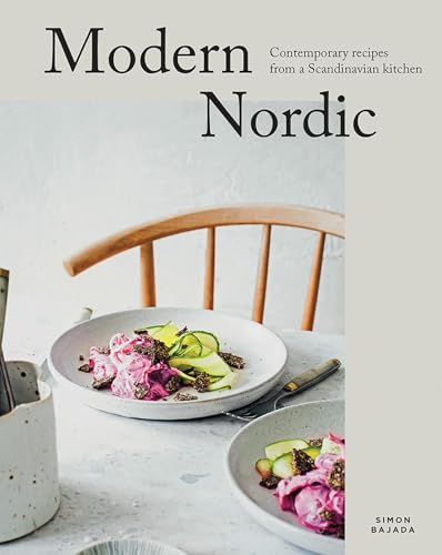 Cookbook cover with food photography and a light wood chair.