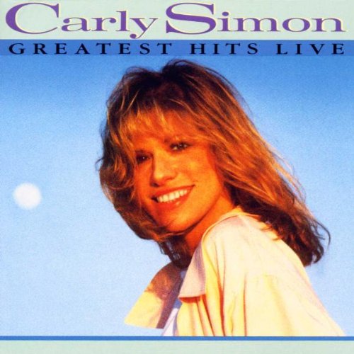 Carly Simon smiling against a blue sky on the Greatest Hits Live album cover.