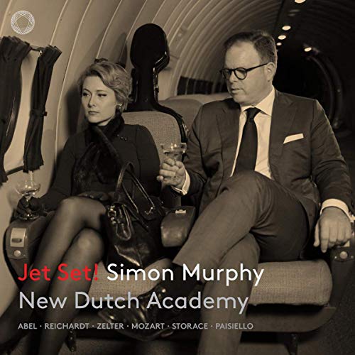 "CD cover featuring a man and woman on a plane, in formal attire."