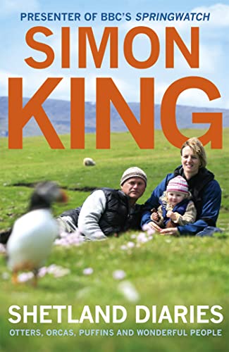 A family sits on a grassy hill with a puffin in the foreground.
