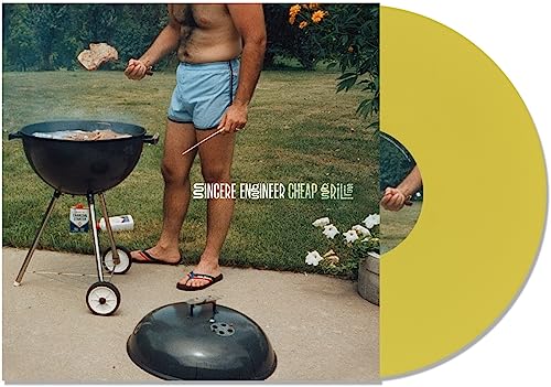 Vinyl record cover featuring a man grilling outdoors on a lawn.