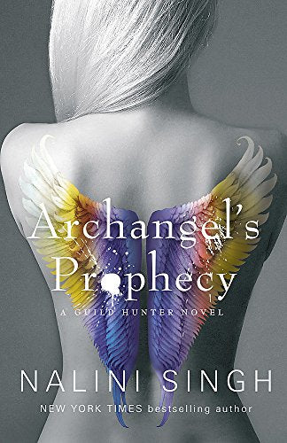 Back view of a woman with long white hair and colorful angel wings.