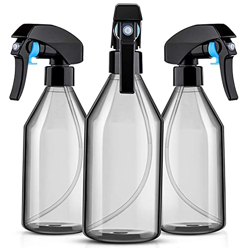 Three grey plastic spray bottles with black triggers, studio shot.