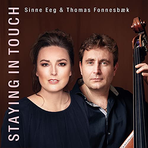 Sinne Eeg and Thomas Fonnesbæk posing together, with Thomas holding a double bass.