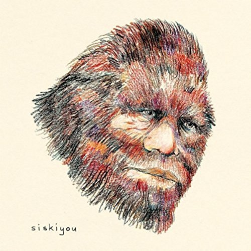 CD cover art: colorful, textured drawing of a Bigfoot's face.