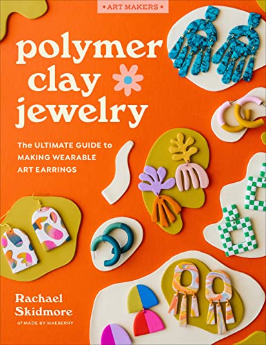 Book cover with colorful polymer clay earrings and floral designs.