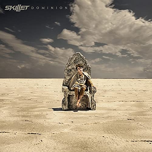 Skillet’s “Dominion” CD cover: man on throne in desert landscape.