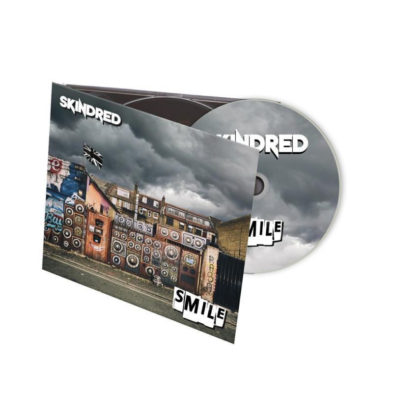 Skindred “Smile” CD case and disc with building and speaker imagery.