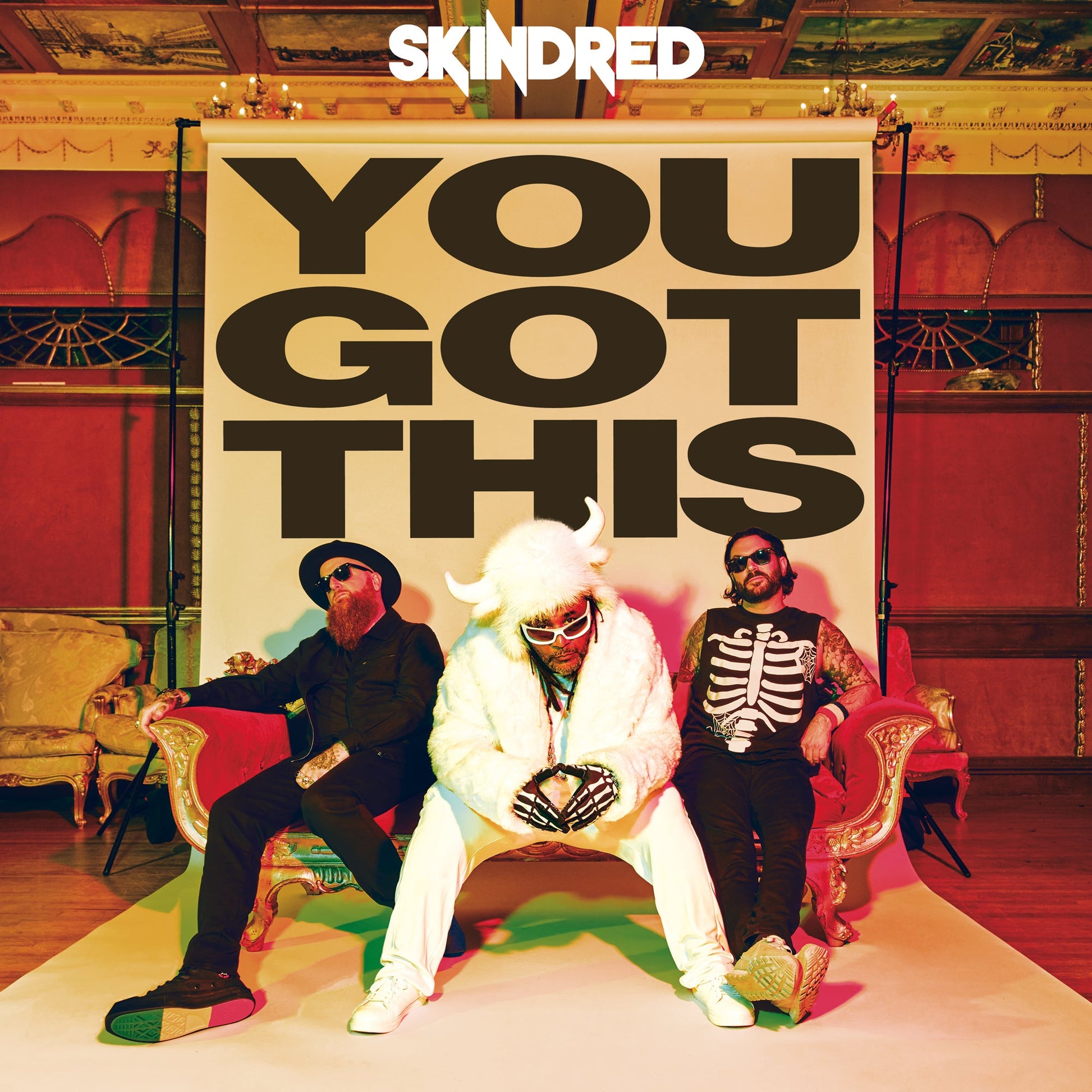 Skindred album cover: band members posing in front of ornate interior.