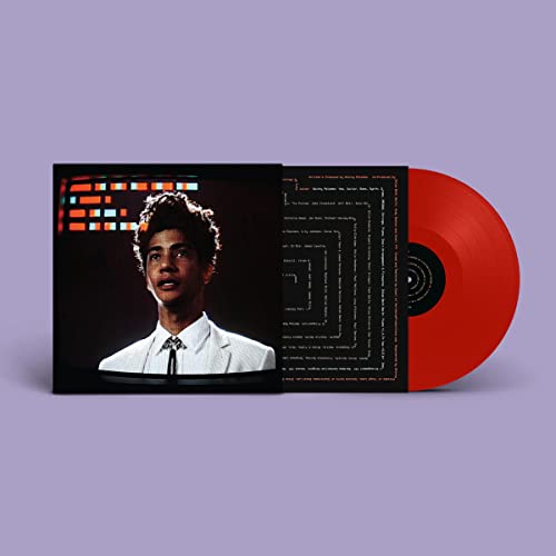Red vinyl record and album cover featuring a portrait of a man.