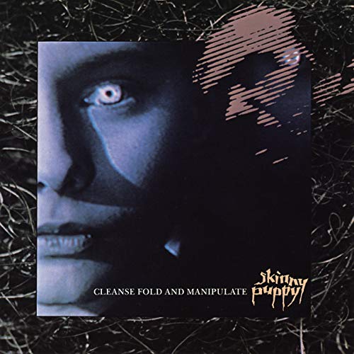 Close-up of a distressed face with one visible eye, album cover.