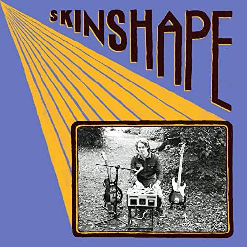 Record cover: "Skinshape" with a man playing guitar outdoors.