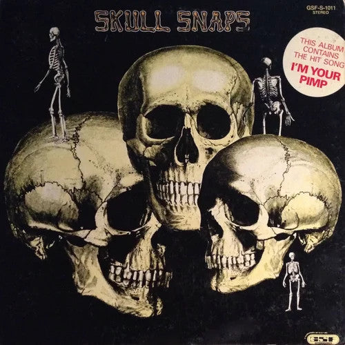 Album cover featuring three large human skulls and small skeletons against a black background.