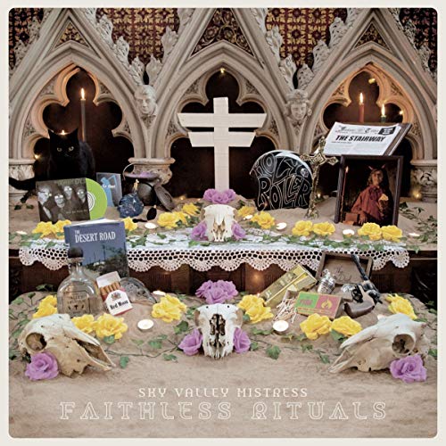 CD cover with occult imagery: skulls, candles, and a black cat.
