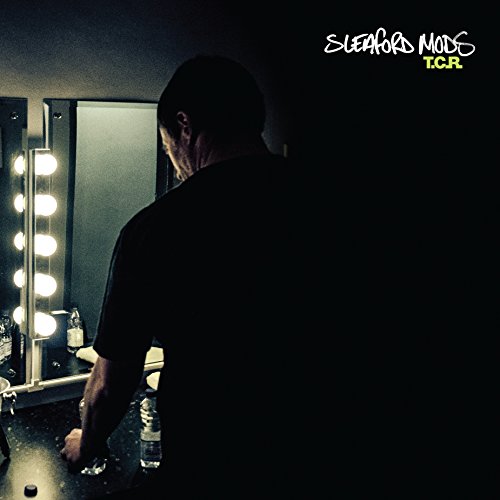 Sleaford Mods album cover: man seen from behind looking in a mirror.