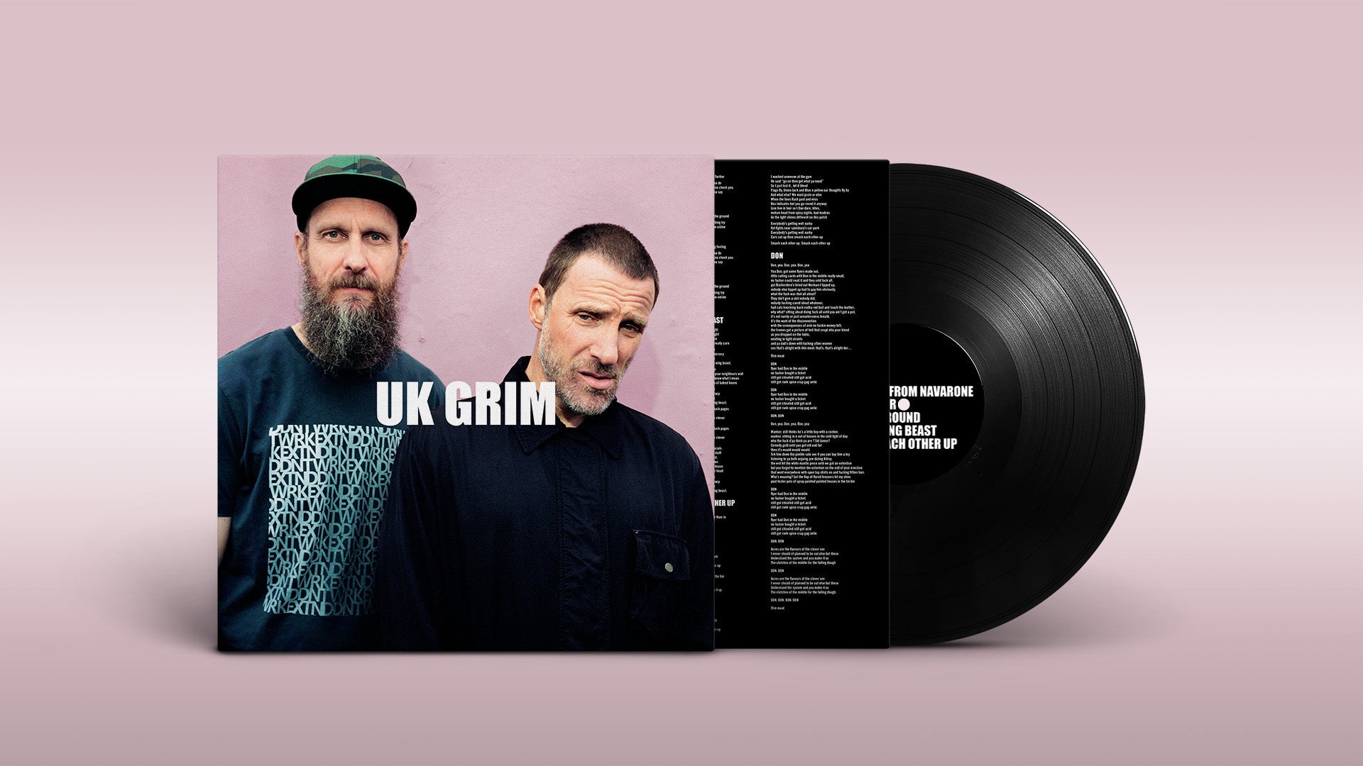 "Vinyl record with sleeve featuring two men and 'UK GRIM' text on pink background."