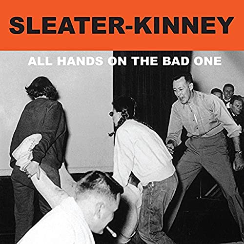 Sleater-Kinney album cover: black and white photo of people dancing.