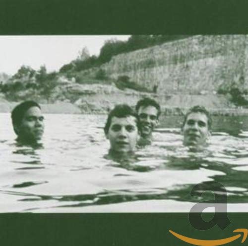 Black and white photo of four people submerged in water.