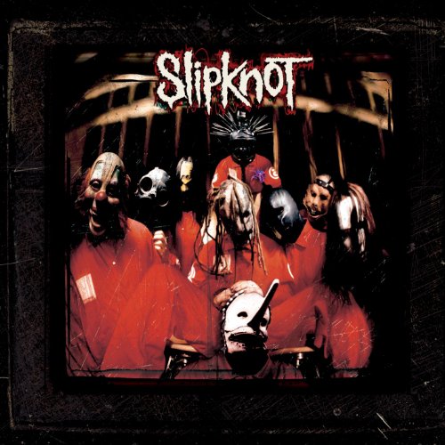 Slipknot band members wearing masks and red jumpsuits on a dark background.
