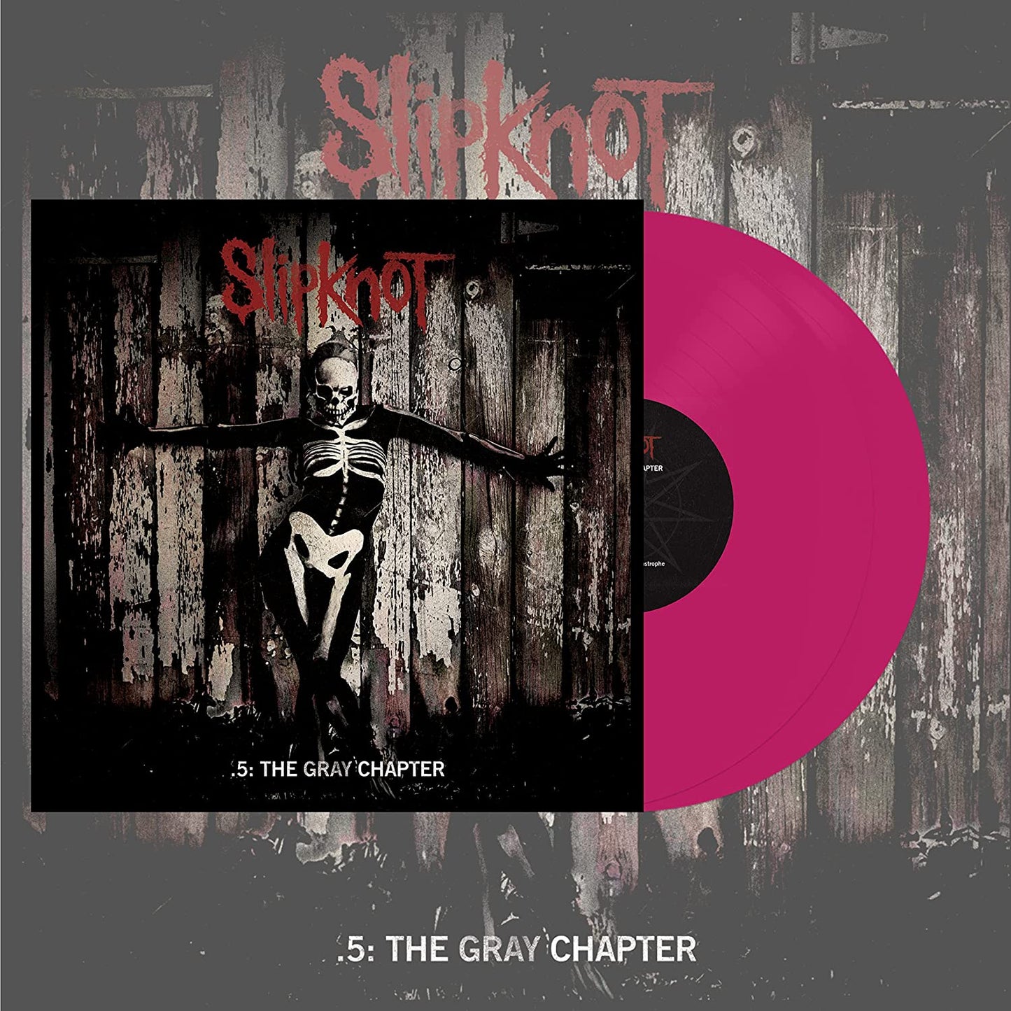 "Slipknot vinyl record with pink disc and album cover featuring a skeleton figure."