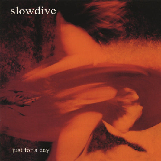 Slowdive album "Just For a Day" CD cover, blurry orange and red tones.