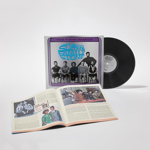 Sly & The Family Stone vinyl record with album cover and open book.