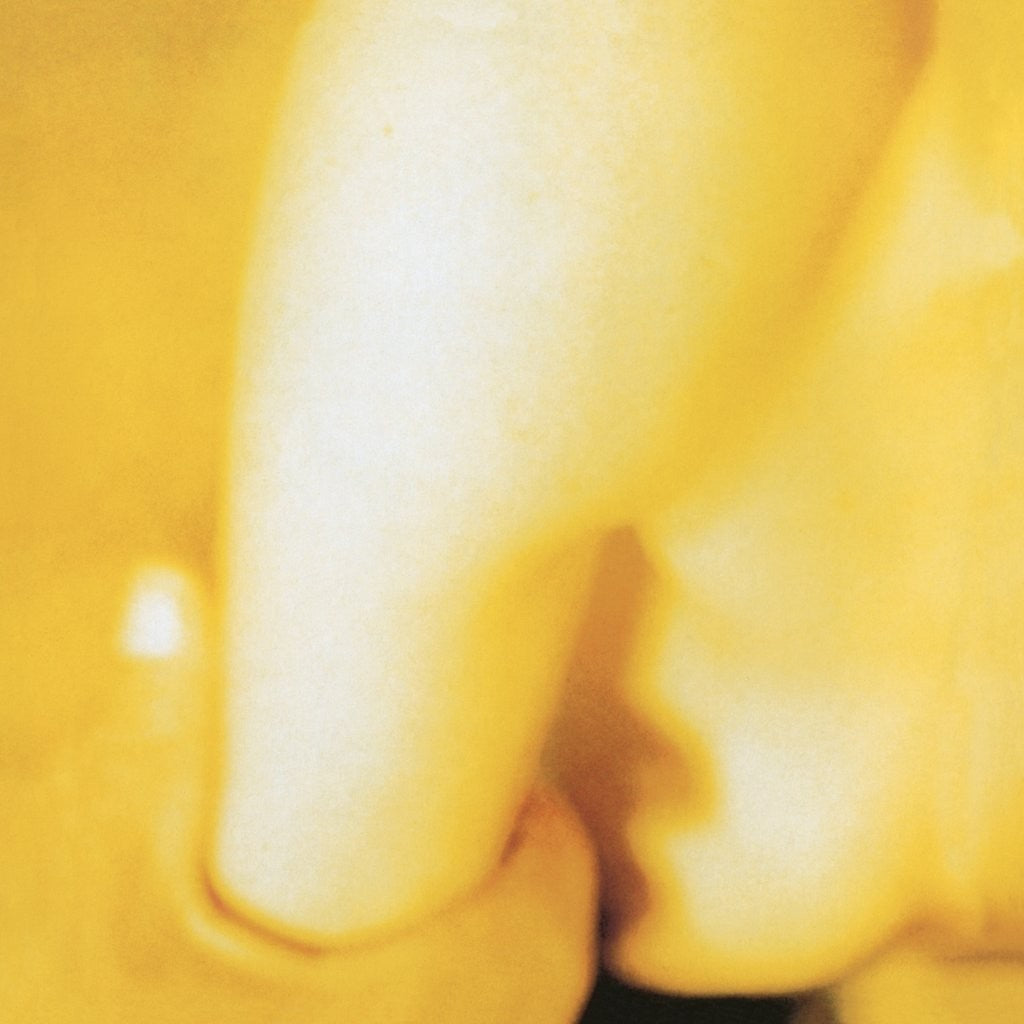 Blurred yellow abstract image, detail from Smashing Pumpkins' *Pisces Iscariot* album.