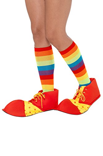 Red and yellow oversized clown shoes with yellow laces, worn with rainbow-striped socks.