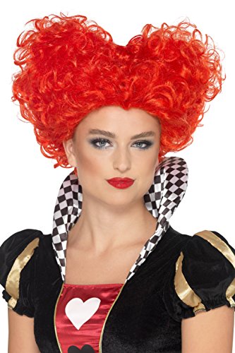 Woman wearing red curly wig and black costume with checkered collar and heart emblem.