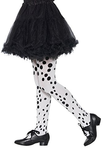 "Child's legs wearing white tights with black spots and a black tutu skirt."